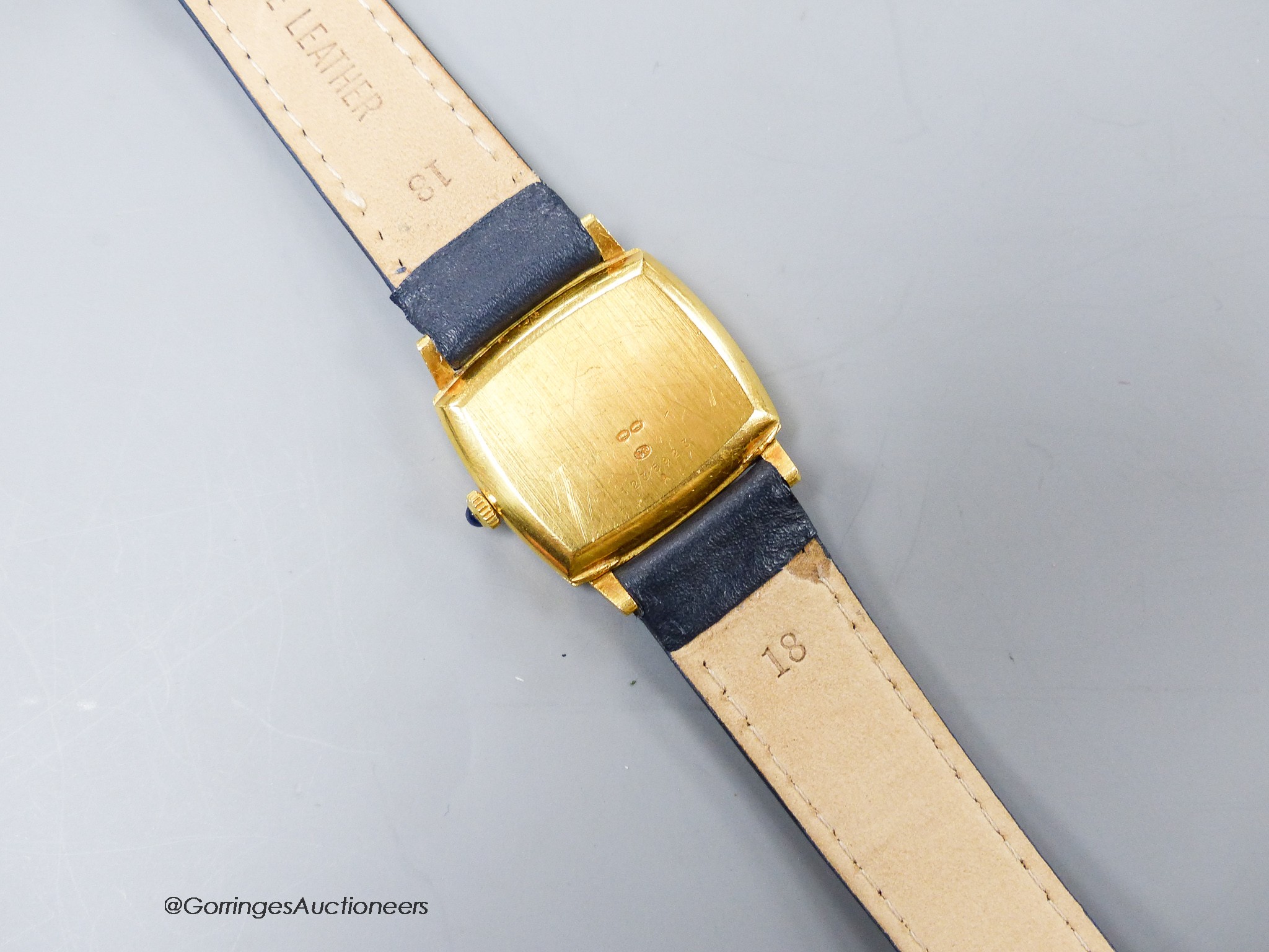 A lady's? 18k yellow metal Jaeger LeCoultre manual wind dress wrist watch with lapis lazuli dial (with loose Roman chapter ring), case diameter 29mm, gross weight29.7 grams.